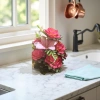 Pink and red artificial flower bouquets with simulated fresh flowers are decorative items for the living room and bedroom details Picture